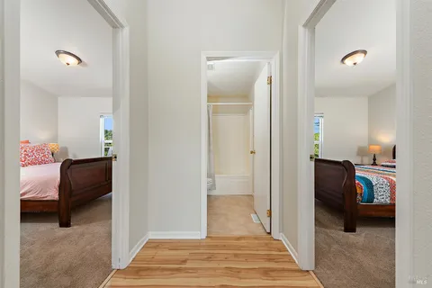 a bedroom with a bed and a lamp