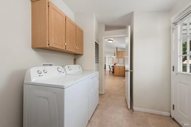 a kitchen with granite countertop a sink cabinets and window