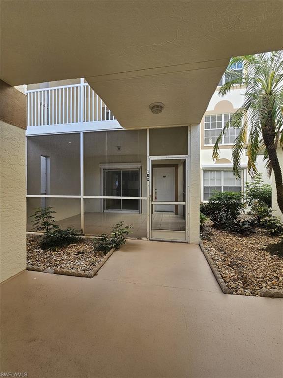 6025 Chardonnay Lane, Unit 102 Naples, FL 34119 - Photo 2 of 37 a view of front door of house