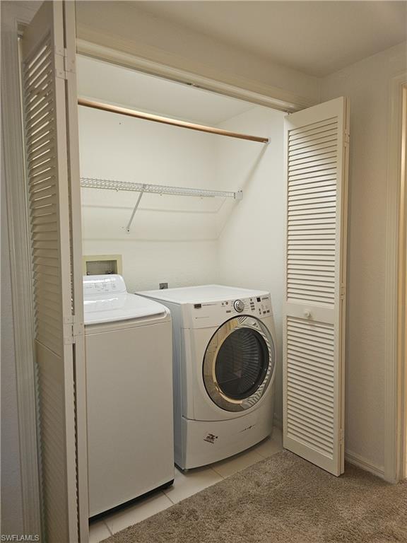6025 Chardonnay Lane, Unit 102 Naples, FL 34119 - Photo 26 of 37 a utility room with dryer and washer