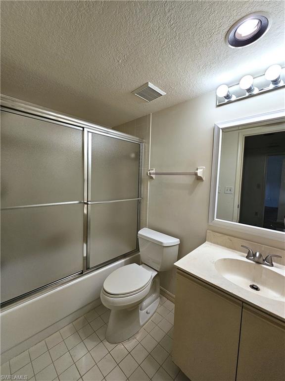 6025 Chardonnay Lane, Unit 102 Naples, FL 34119 - Photo 27 of 37 a bathroom with a toilet a sink and shower