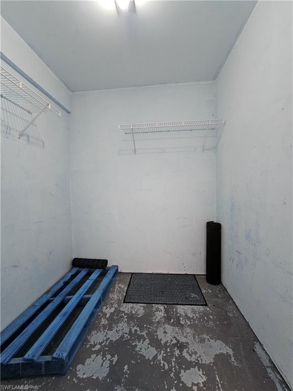 6025 Chardonnay Lane, Unit 102 Naples, FL 34119 - Photo 32 of 37 a bathroom with a rug