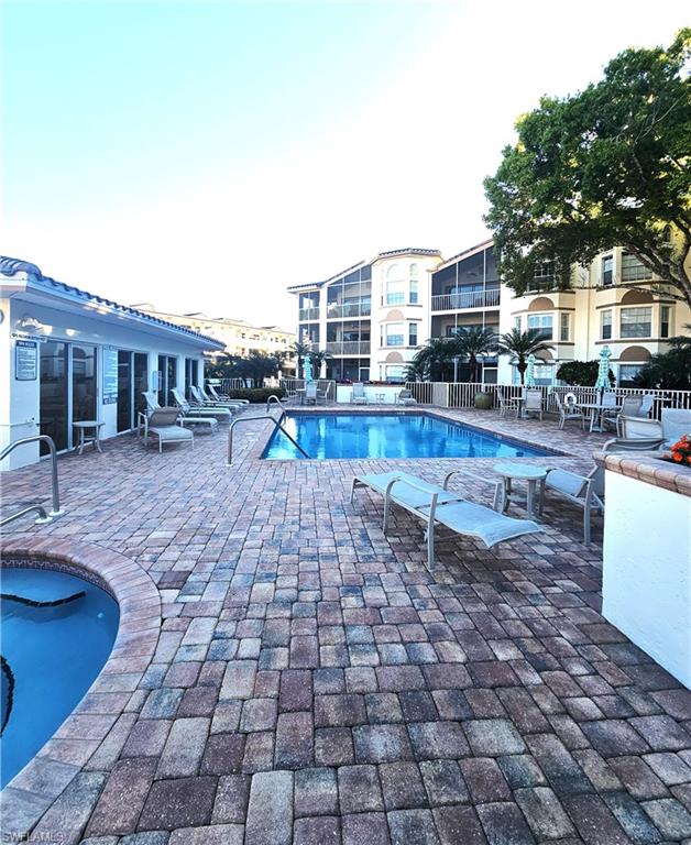 6025 Chardonnay Lane, Unit 102 Naples, FL 34119 - Photo 36 of 37 a view of a yard with a patio