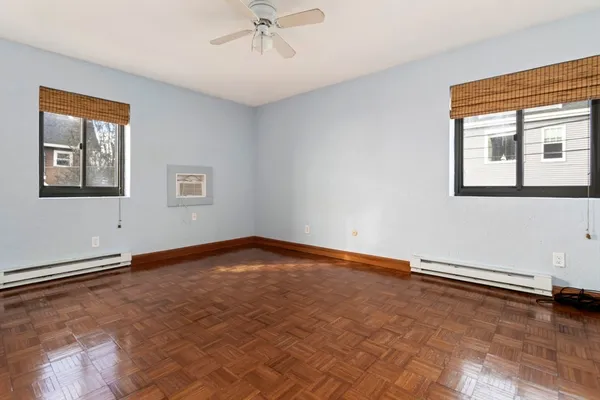a view of an empty room with a window