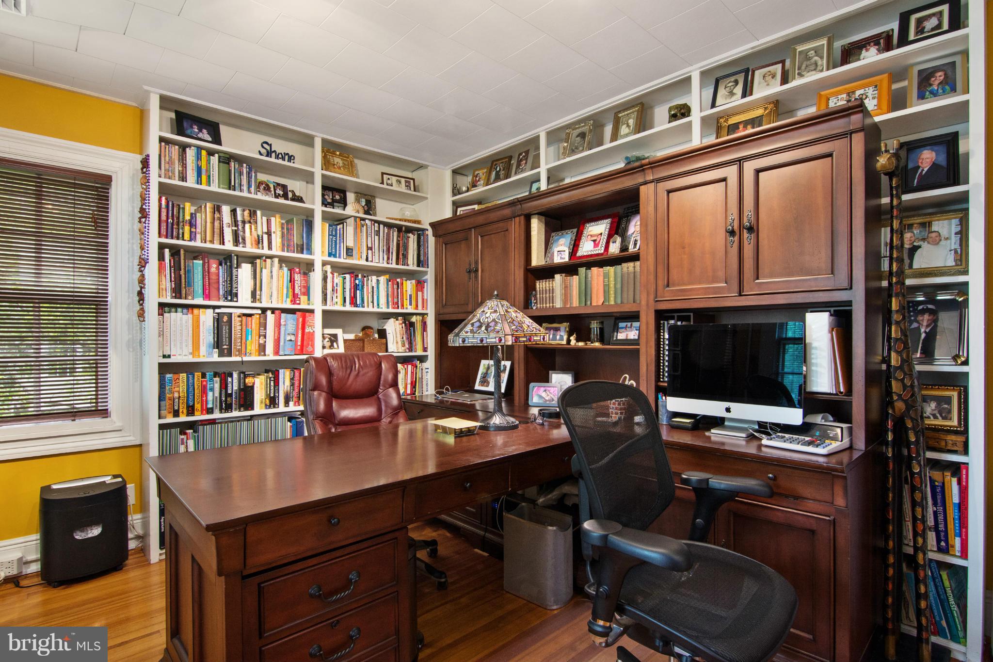 5101 Woodside Road Baltimore, MD 21229 - Photo 22 of 30 a view of a workspace with bookshelf