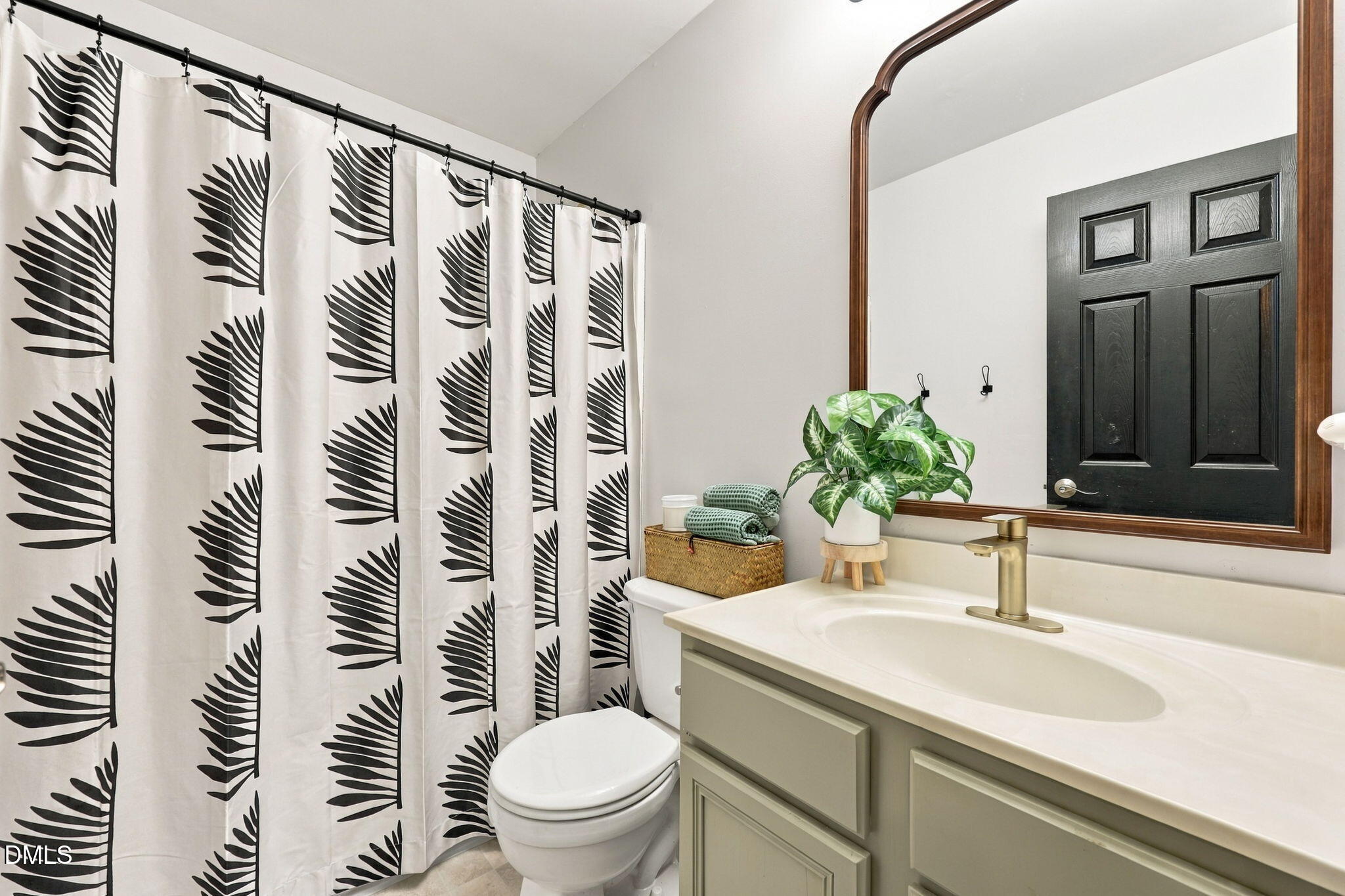 6 Sydenham Road Durham, NC 27713 - Photo 36 of 44 Spa-inspired bathroom featuring a ceramic vessel sink with brushed nickel faucet, soft-close cabinetry with ample storage, and a quartz countertop