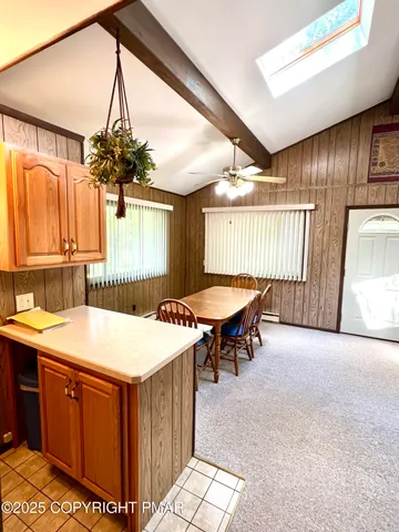 a room with a table chairs and a table