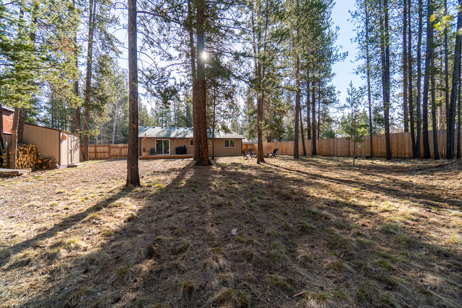 55741 Swan Road Bend, OR 97707 - Photo 33 of 35 Fenced back yard as viewed from the rear gate.