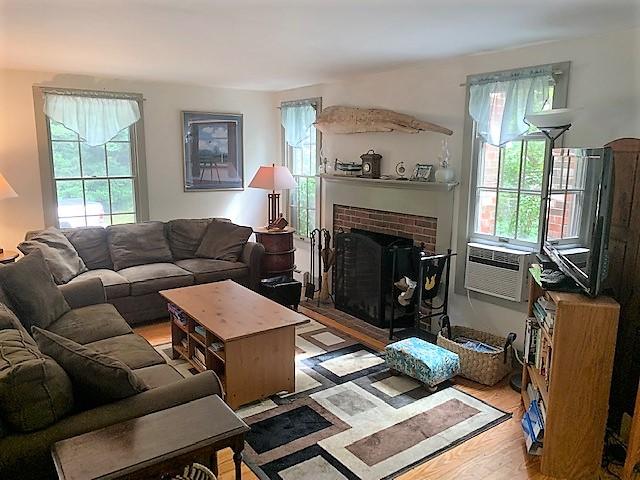 35 Salt Pond Road Eastham, MA 02642 - Photo 3 of 34 a living room with furniture and a fireplace
