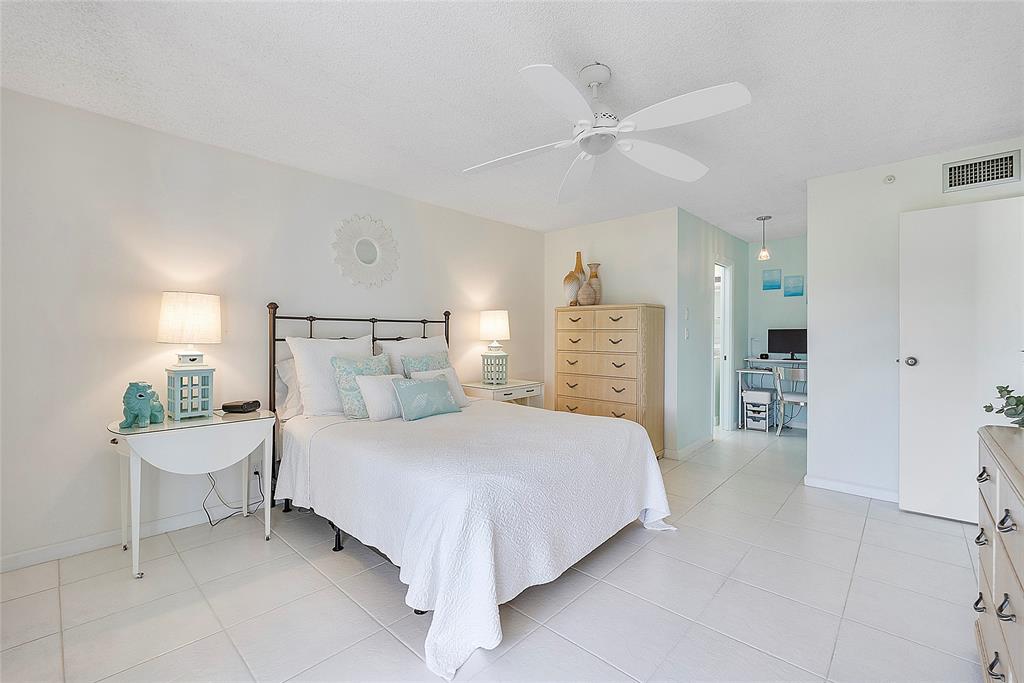 6080 Northwest 44th Street, Unit 214 Lauderhill, FL 33319 - Photo 13 of 17 a bedroom with a bed and a cabinets
