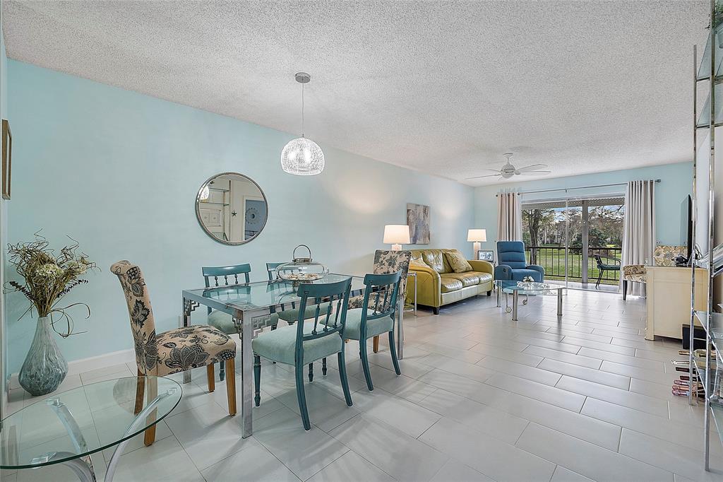 6080 Northwest 44th Street, Unit 214 Lauderhill, FL 33319 - Photo 3 of 17 a living room with furniture and a large window