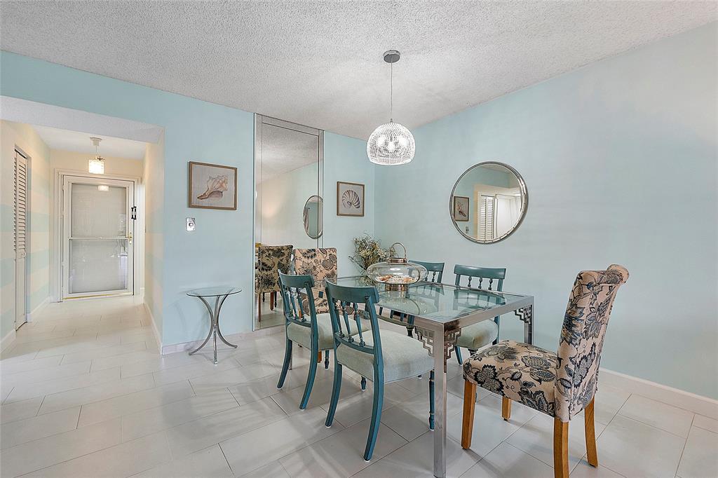 6080 Northwest 44th Street, Unit 214 Lauderhill, FL 33319 - Photo 6 of 17 a view of a dining room and a livingroom