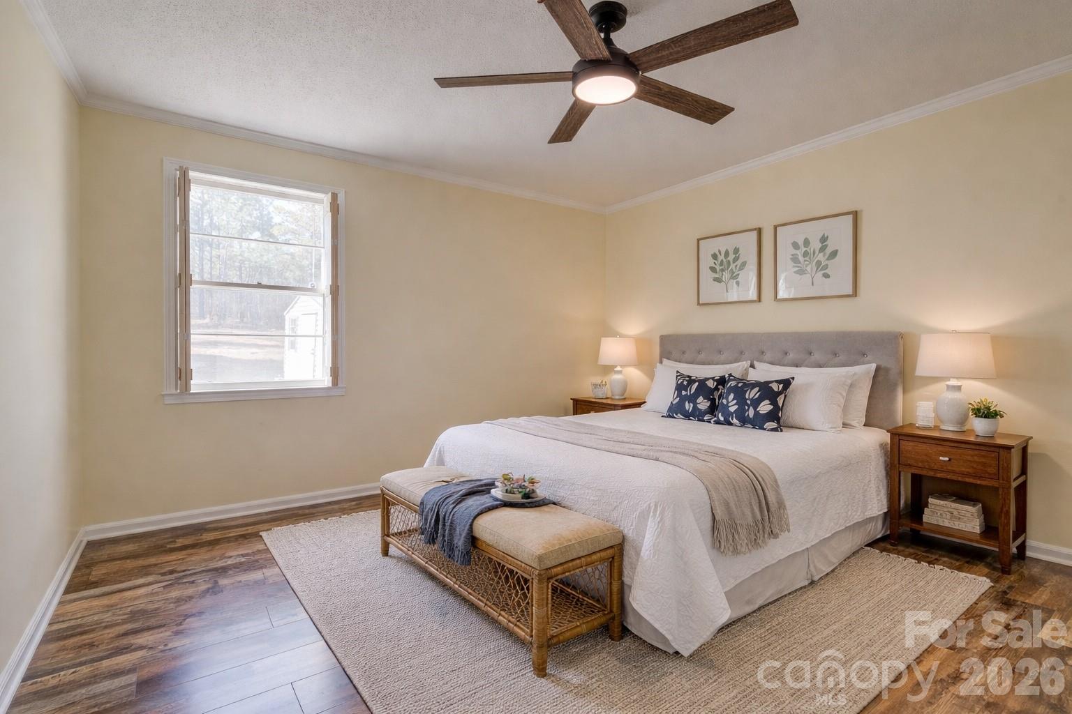 8684 Teals Mill Road Cheraw, SC 29520 - Photo 14 of 34 a bedroom with a large bed and a window