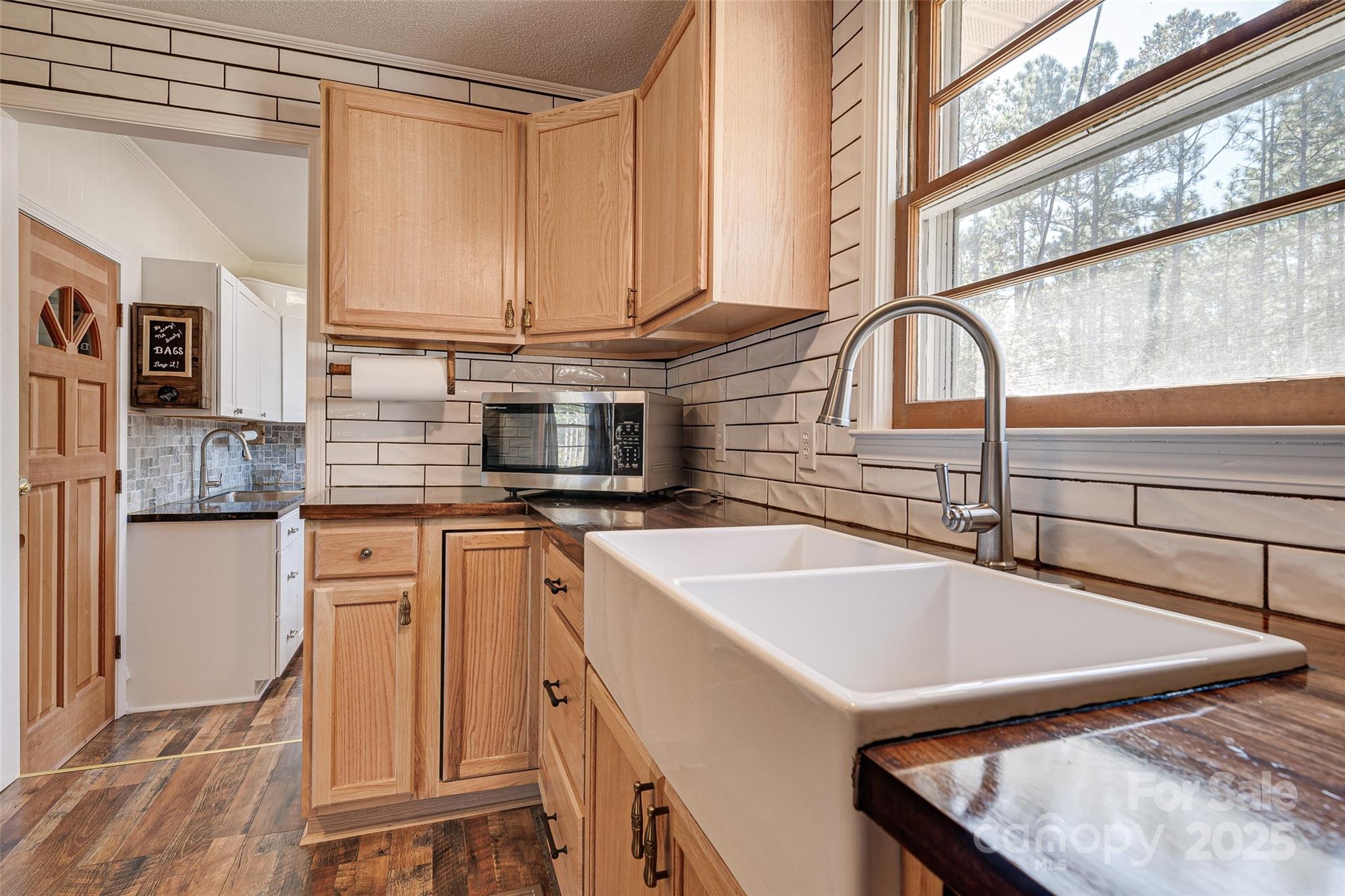 8684 Teals Mill Road Cheraw, SC 29520 - Photo 17 of 36 a kitchen with stainless steel appliances granite countertop a sink and a white cabinets