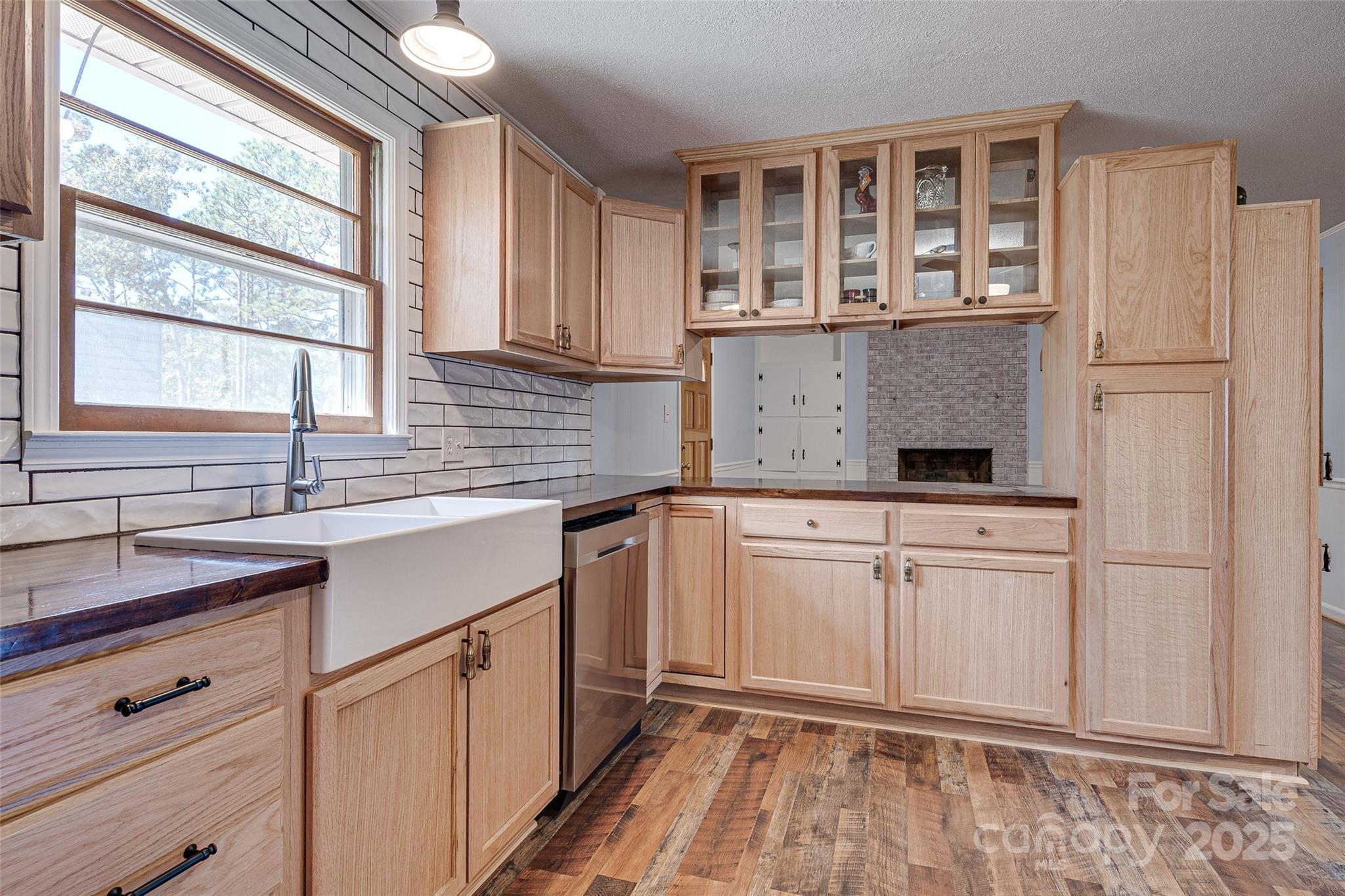 8684 Teals Mill Road Cheraw, SC 29520 - Photo 19 of 36 a kitchen with stainless steel appliances granite countertop a sink stove and cabinets