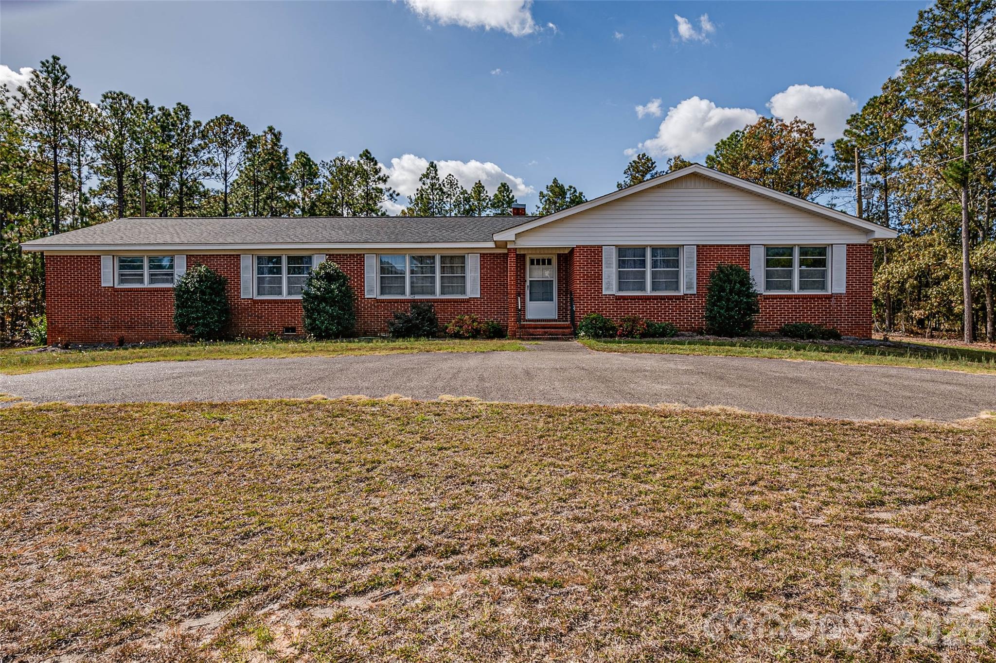 8684 Teals Mill Road Cheraw, SC 29520 - Photo 23 of 34 a front view of a house with a yard