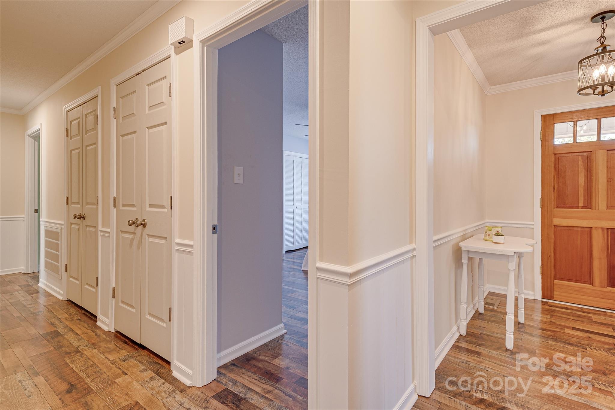 8684 Teals Mill Road Cheraw, SC 29520 - Photo 23 of 36 a view of a hallway with wooden floor and cabinet