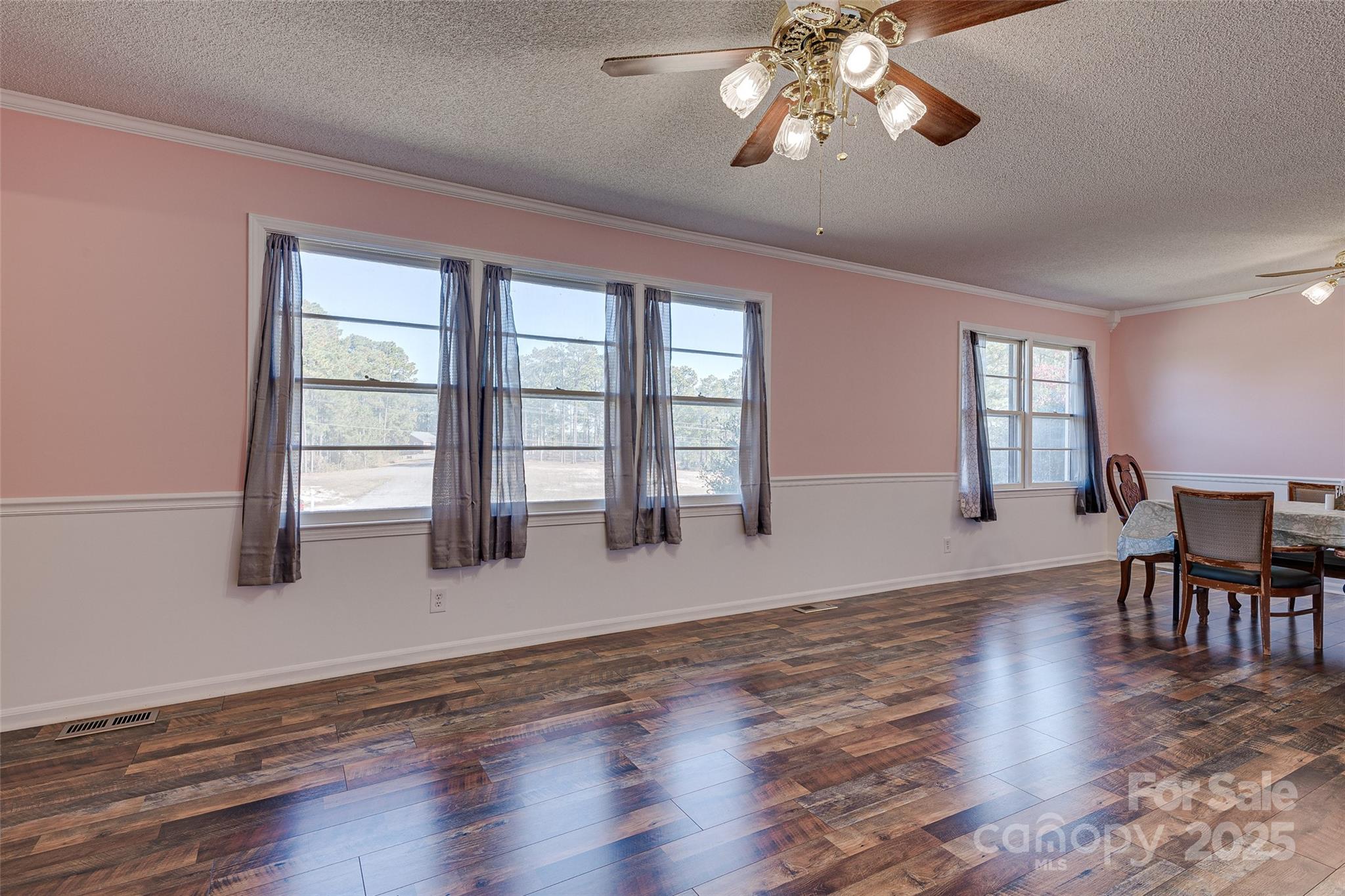 8684 Teals Mill Road Cheraw, SC 29520 - Photo 29 of 36 a view of an empty room with wooden floor and a window