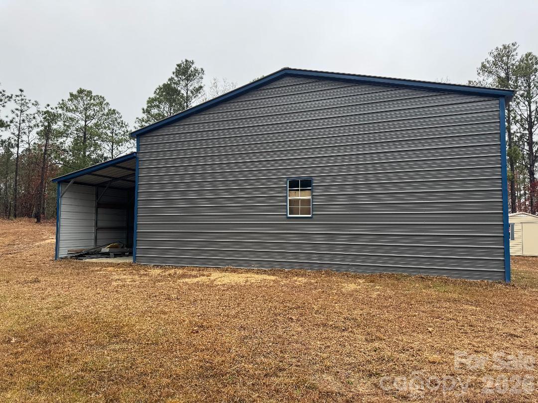 8684 Teals Mill Road Cheraw, SC 29520 - Photo 29 of 34 a front view of a house with a yard