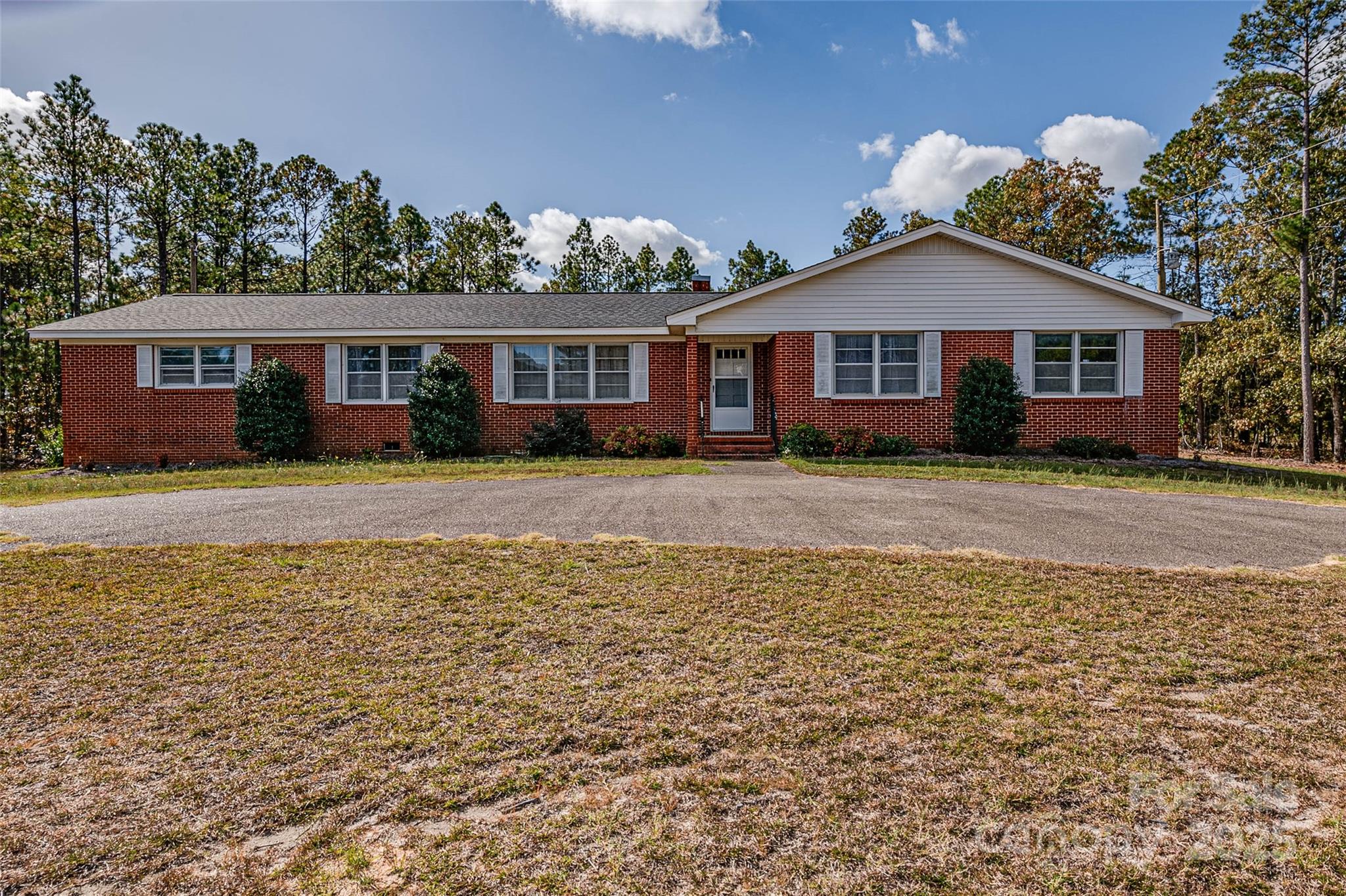 8684 Teals Mill Road Cheraw, SC 29520 - Photo 3 of 36 a front view of a house with a yard