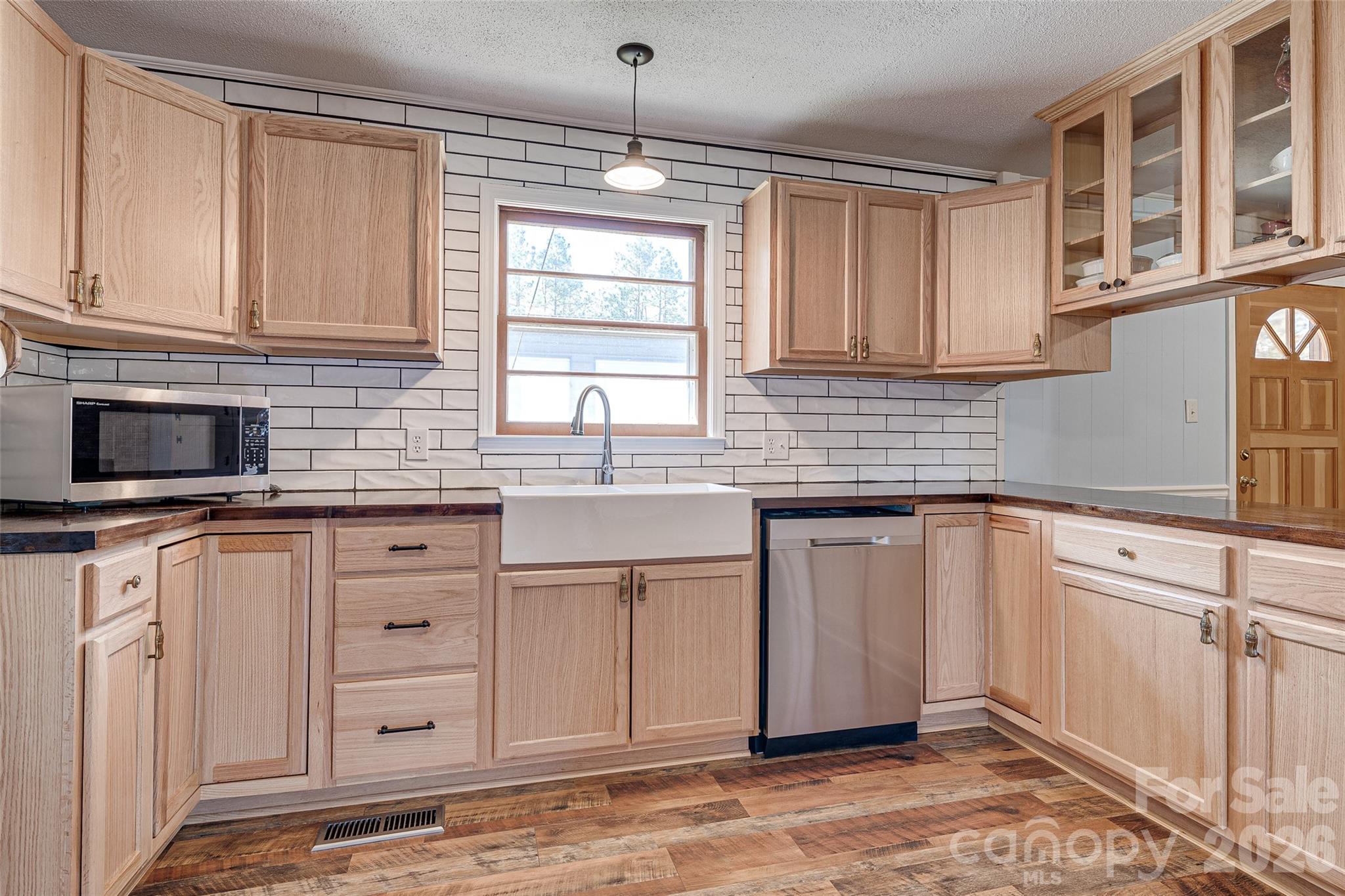 8684 Teals Mill Road Cheraw, SC 29520 - Photo 6 of 34 a kitchen with stainless steel appliances granite countertop a sink stove and cabinets