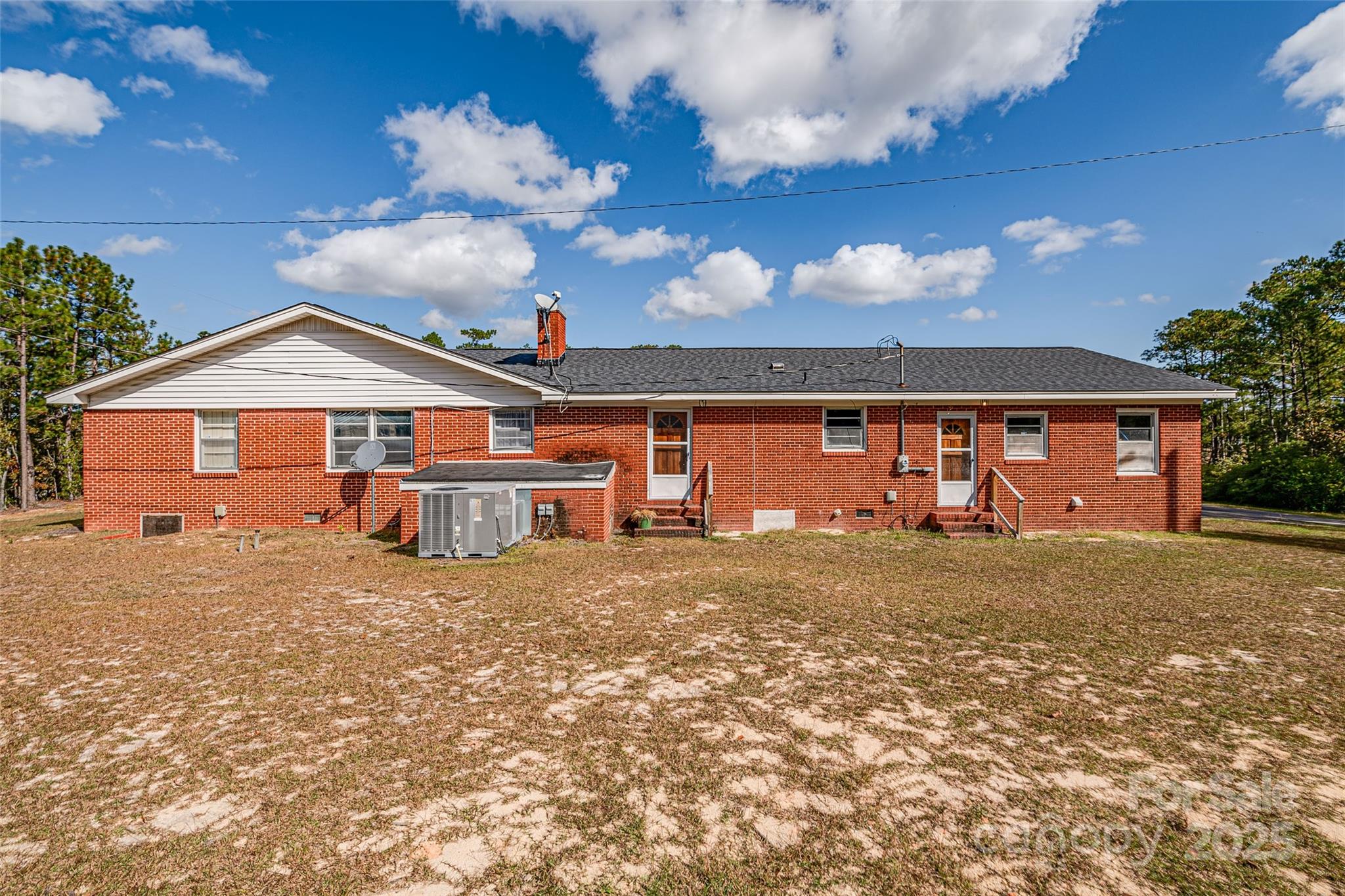8684 Teals Mill Road Cheraw, SC 29520 - Photo 7 of 36 a front view of a house with a yard