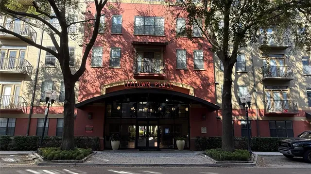 a view of a building with a tree