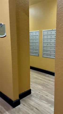 a view of an empty room and wooden floor