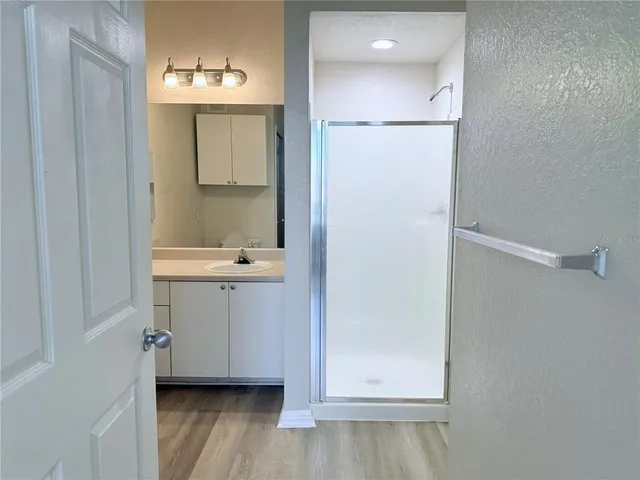a bathroom with a sink a mirror and a vanity
