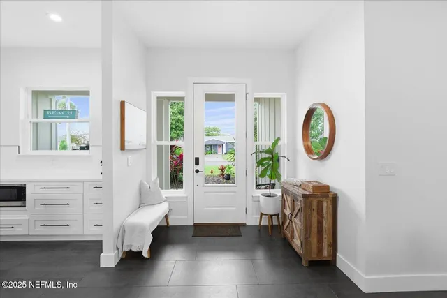a kitchen with stove a sink dishwasher and a stove with wooden floor