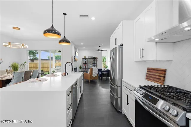 a living room with furniture and a lamp