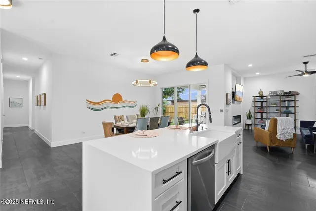 a living room with furniture and a book shelf