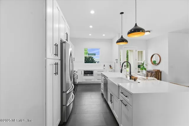 a bedroom with a bed and a table