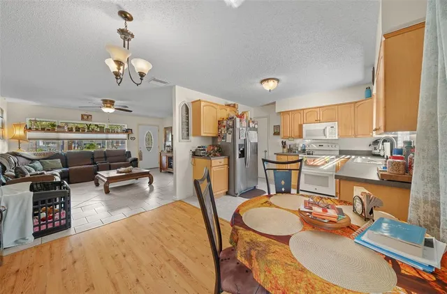 a kitchen with stainless steel appliances granite countertop a refrigerator sink and cabinets