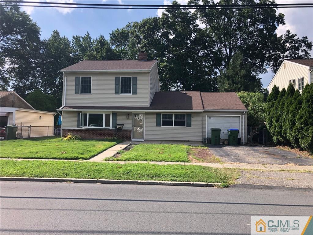 a house that has a tree in front of it