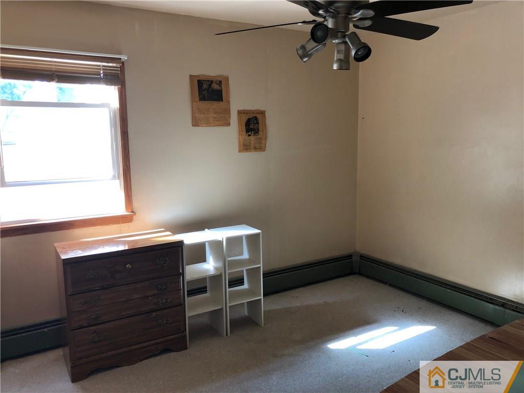 160 Winthrop Road Edison, NJ 08817 - Photo 12 of 18 a room with a table and a window