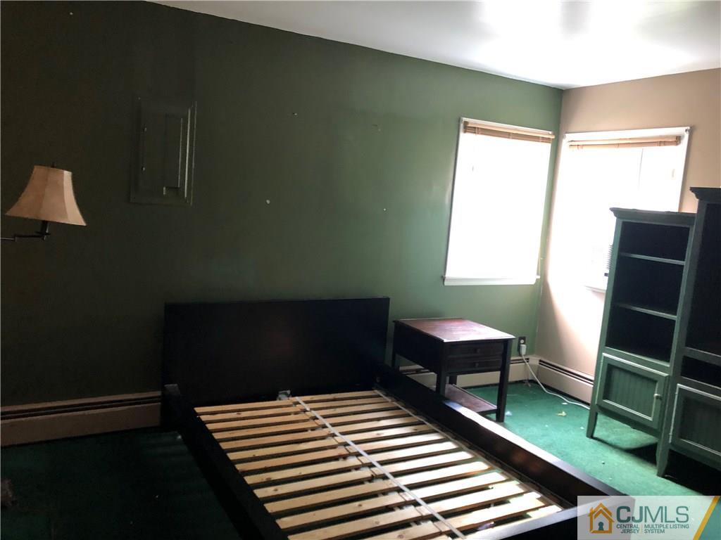 160 Winthrop Road Edison, NJ 08817 - Photo 13 of 18 a bedroom with a bed and a window