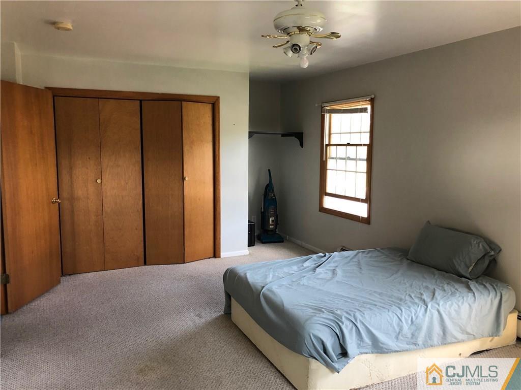 160 Winthrop Road Edison, NJ 08817 - Photo 18 of 18 a bedroom with a bed and a window