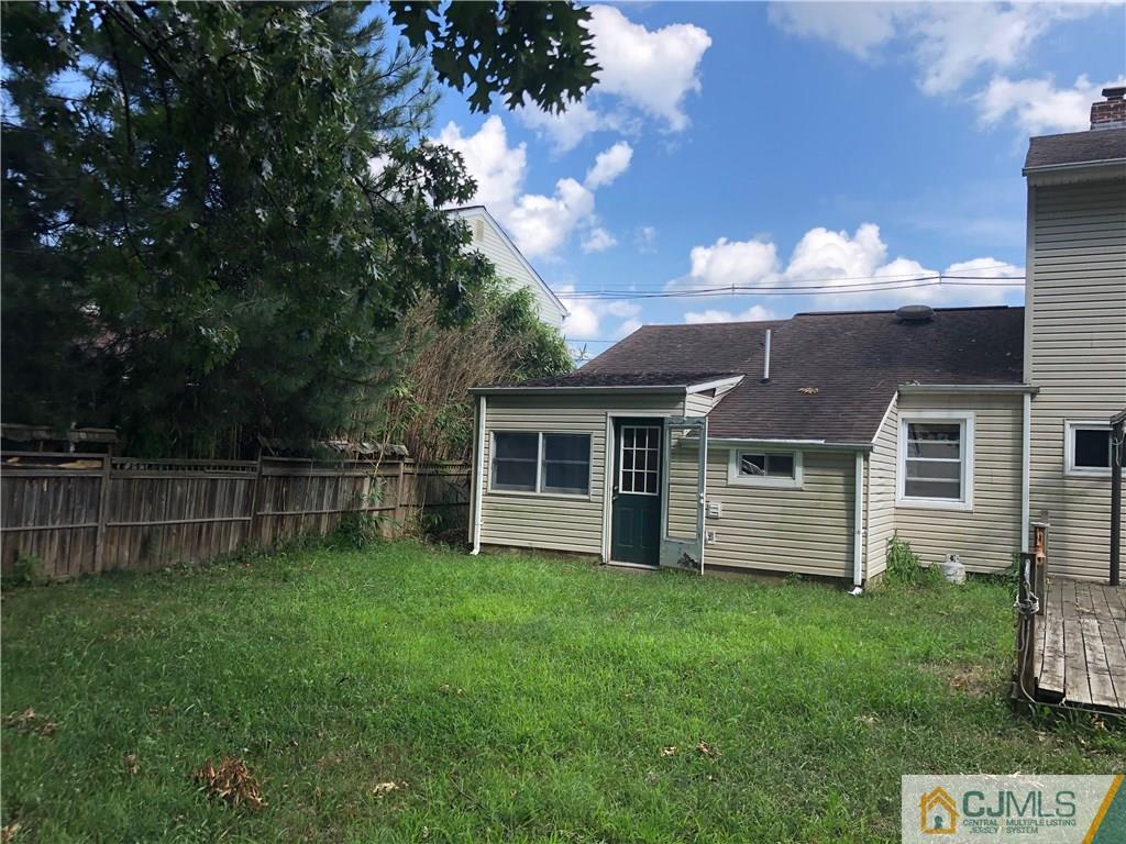 160 Winthrop Road Edison, NJ 08817 - Photo 4 of 18 a backyard of a house with table and chairs