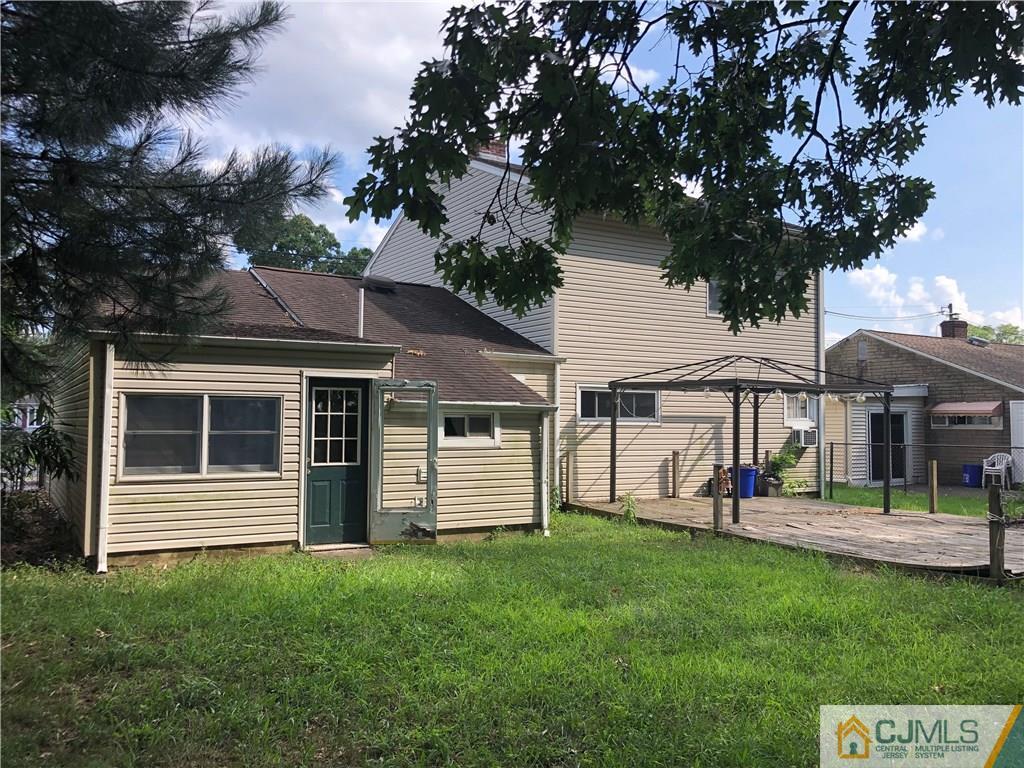 160 Winthrop Road Edison, NJ 08817 - Photo 5 of 18 a view of a house with a backyard