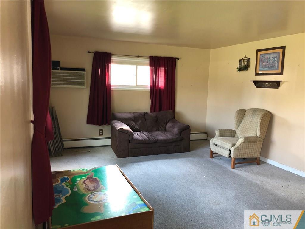 160 Winthrop Road Edison, NJ 08817 - Photo 6 of 18 a living room with furniture and a couch
