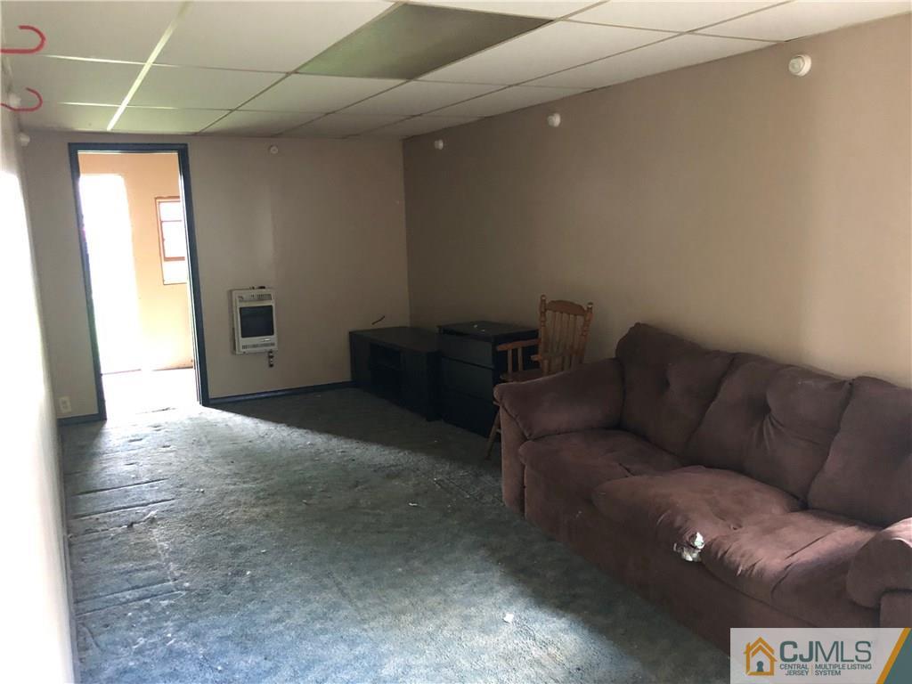 160 Winthrop Road Edison, NJ 08817 - Photo 8 of 18 a living room with furniture and a rug