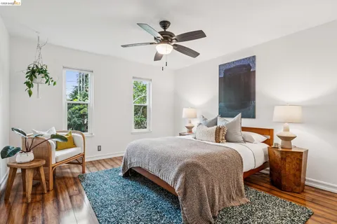 a bedroom with a bed and a mirror