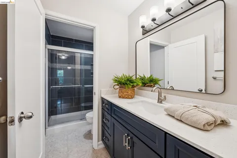 a bathroom with a shower and toilet