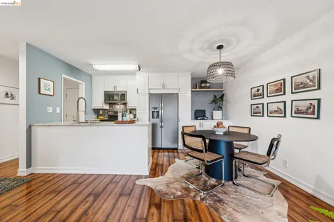 a workspace with furniture and chandelier