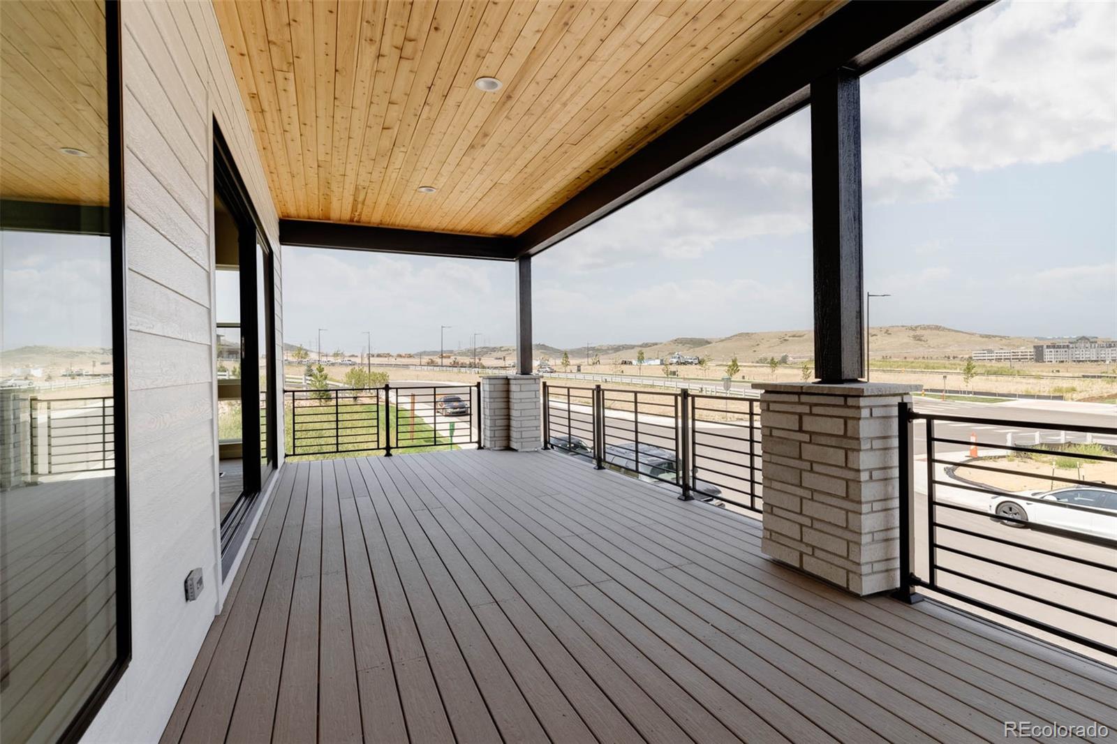 11468 Alla Breve Lone Tree, CO 80134 - Photo 17 of 34 a view of balcony with wooden floor