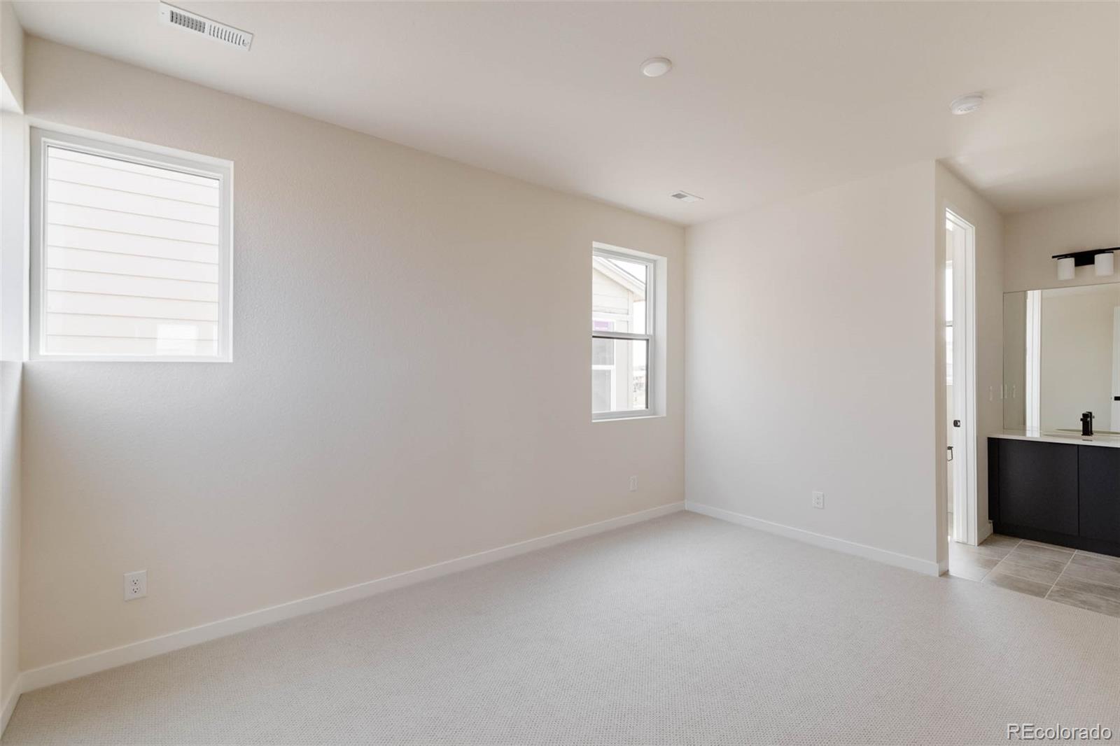 11468 Alla Breve Lone Tree, CO 80134 - Photo 26 of 34 an empty room with windows