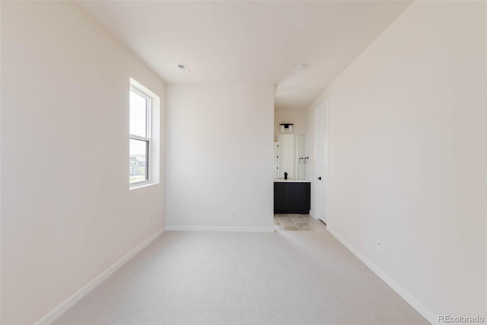 11468 Alla Breve Lone Tree, CO 80134 - Photo 27 of 34 a view of an empty room with a window