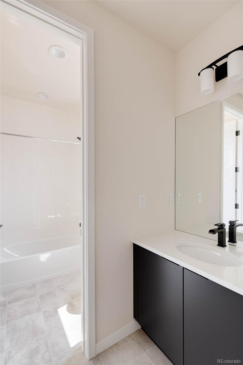 11468 Alla Breve Lone Tree, CO 80134 - Photo 28 of 34 a bathroom with a shower and a sink