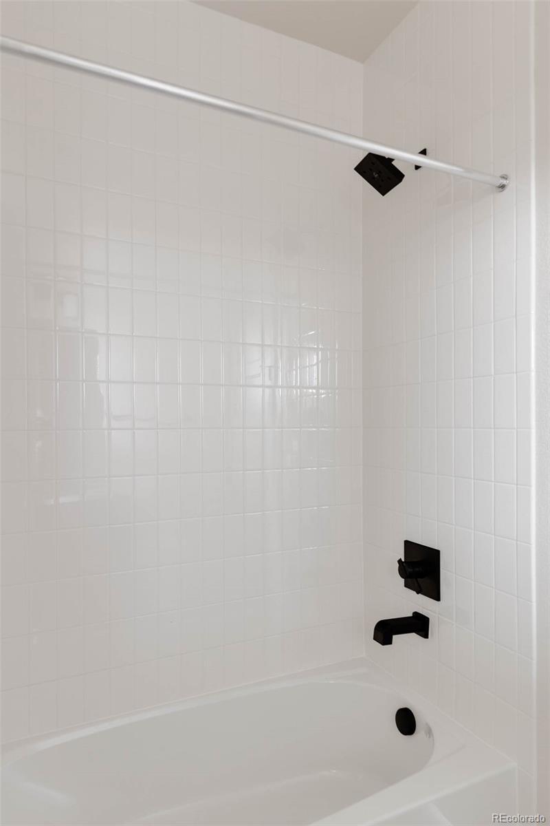 11468 Alla Breve Lone Tree, CO 80134 - Photo 33 of 34 a bathroom with a shower